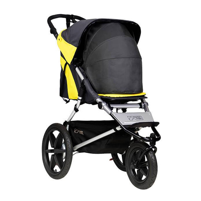 Mountain Buggy terrain stroller in yellow and black solus colour with newborn cocoon accessory_solus