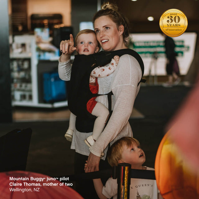 mom carrying child in juno™ carrier pack using parent facing position - Mountain Buggy juno™ pilot Claire Thomas, mother of two, Wellington, New Zealand