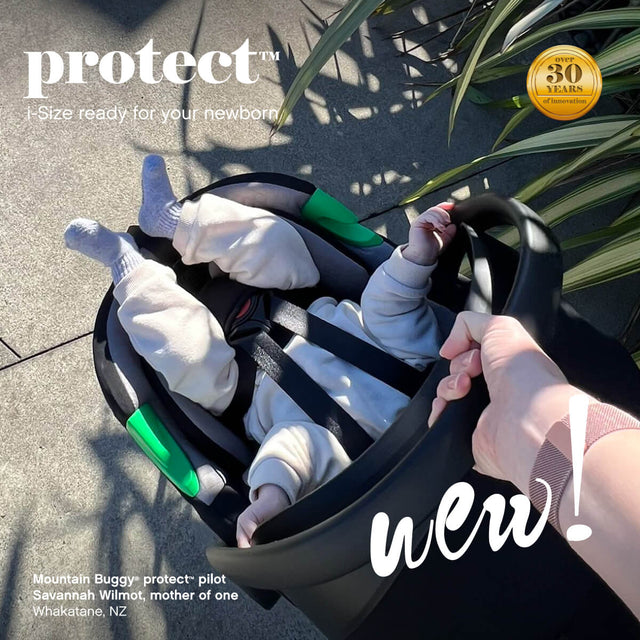baby sitting in car seat capsule being carried by Savannah Wilmot using the handle of the mountain buggy protect™ infant car seat - Whakatane New Zealand