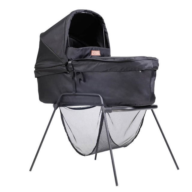mountain buggy swift and mini carrycot plus in lie flat mode on carrycot stand shown in color black_black
