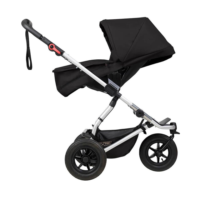 mountain buggy swift compact buggy with carrycot plus in parent facing mode side view shown in color black_black