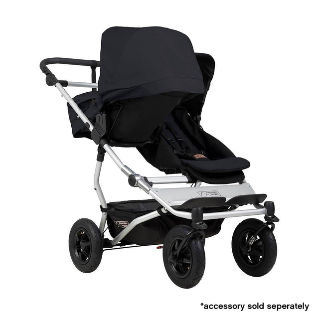 Mountain Buggy duet double buggy fitted with one carrycot plus in parent facing seat position in colour black_black