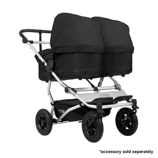 Mountain Buggy duet double buggy fitted with two carrycot plus in parent facing seat position in colour black_black
