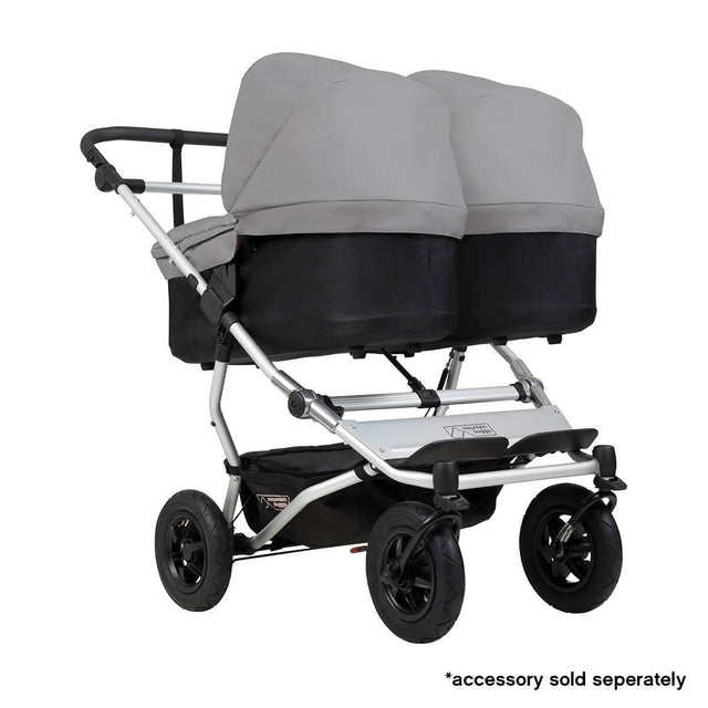 Mountain Buggy duet double buggy fitted with two carrycot plus in parent facing seat position in colour silver_silver