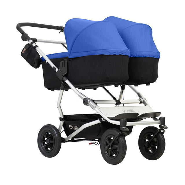 Mountain Buggy duet double buggy with two carrycot plus in lie flat mode 3/4 view shown in color marine _marine