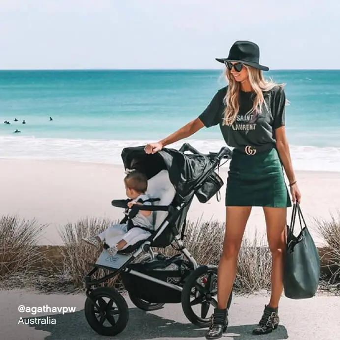 Mountain Buggy terrain all terrain pushchair – mum and toddler on coastal path with beach view, Australia