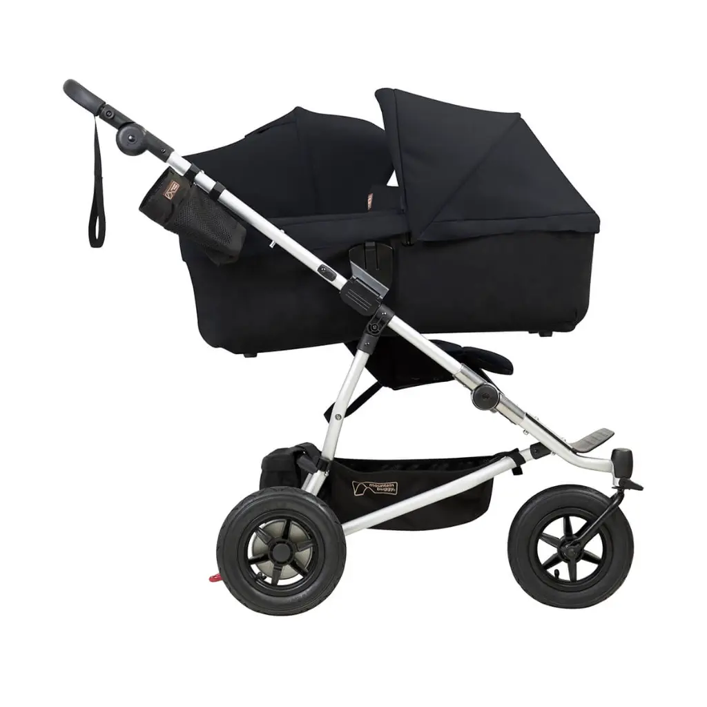 Mountain-Buggy-duet-buggy-with-single-black-carrycot-plus-in-lie-flat-mode-side-view.webp