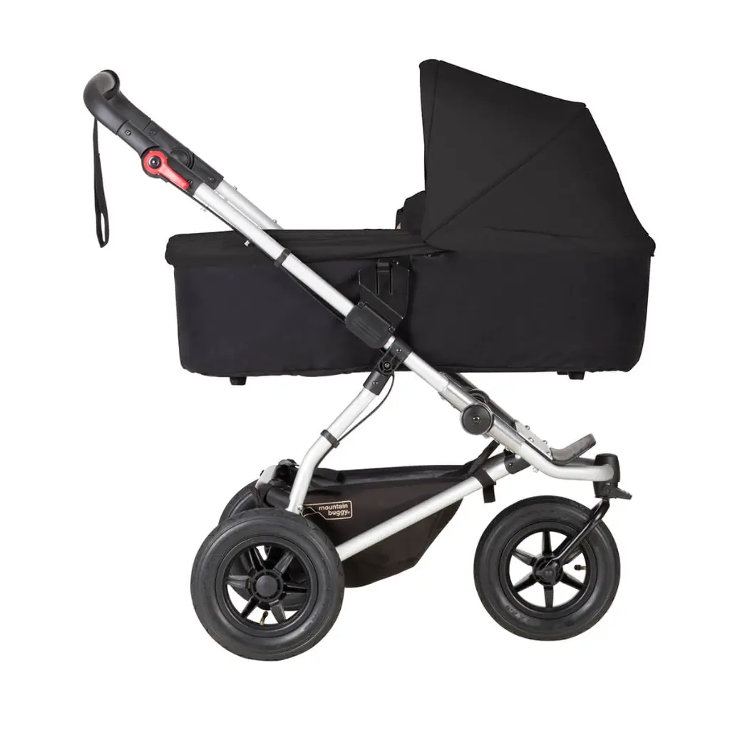 Mountain-Buggy-black-carrycot-plus-on-swift-buggy-in-lie-flat-mode-side-view.webp